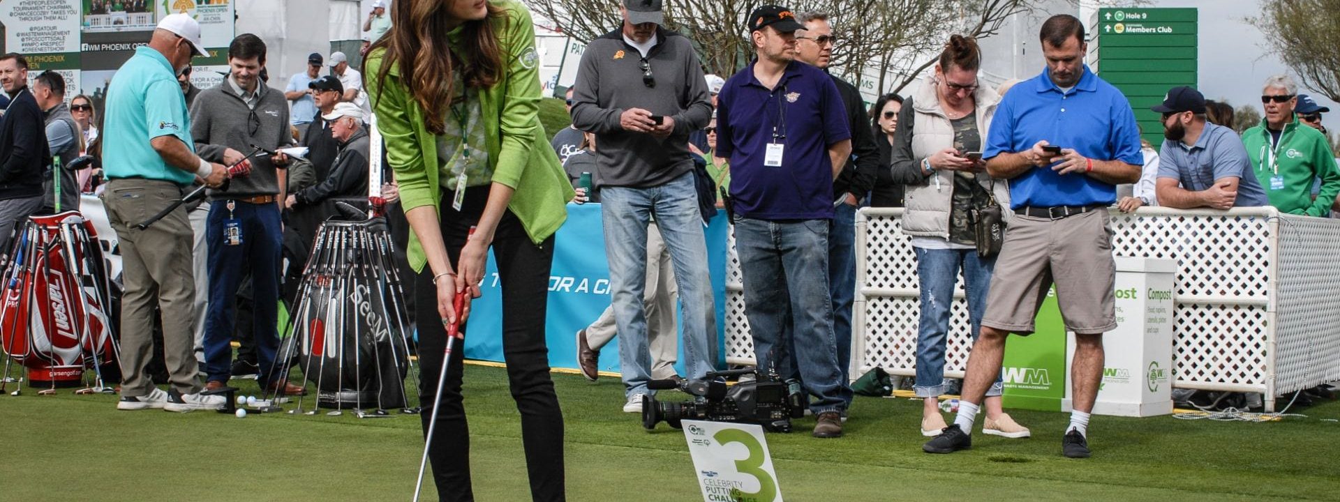 Celebrity putting challenge participant golfing